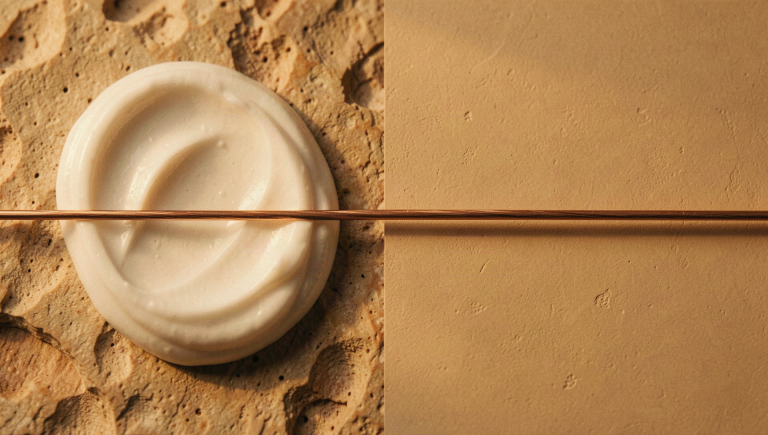 'A cream swirl and a smooth plaster surface divided by a fine copper rule - topical versus systemic'